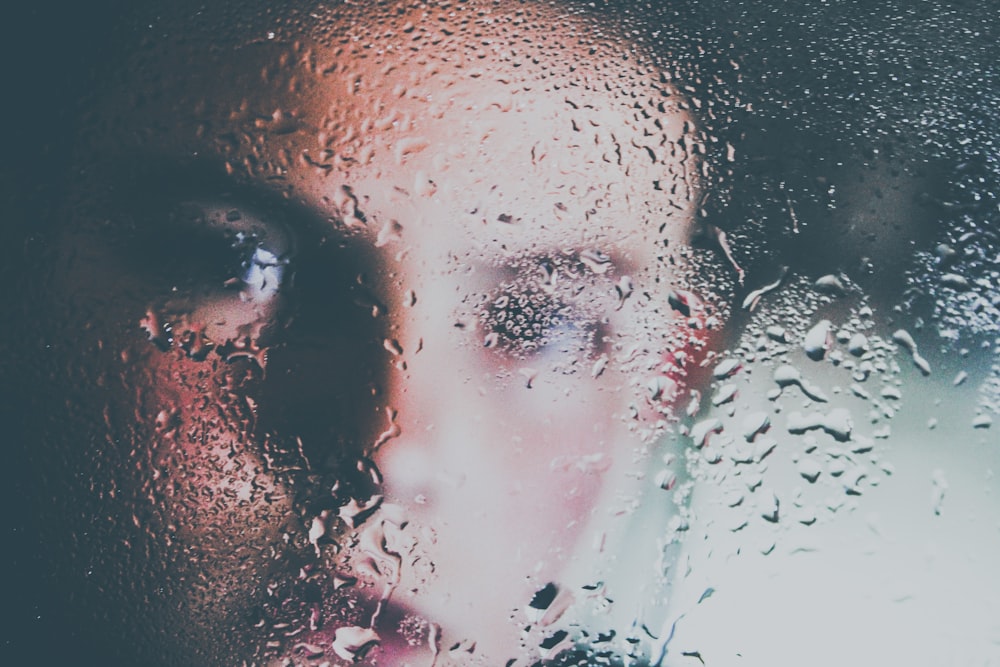 photo of boy behind glass