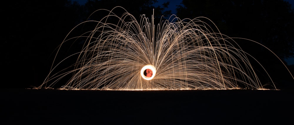 a long exposure of a firework in the dark