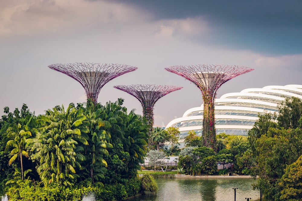 three multicolored landmarks under blue and white sky