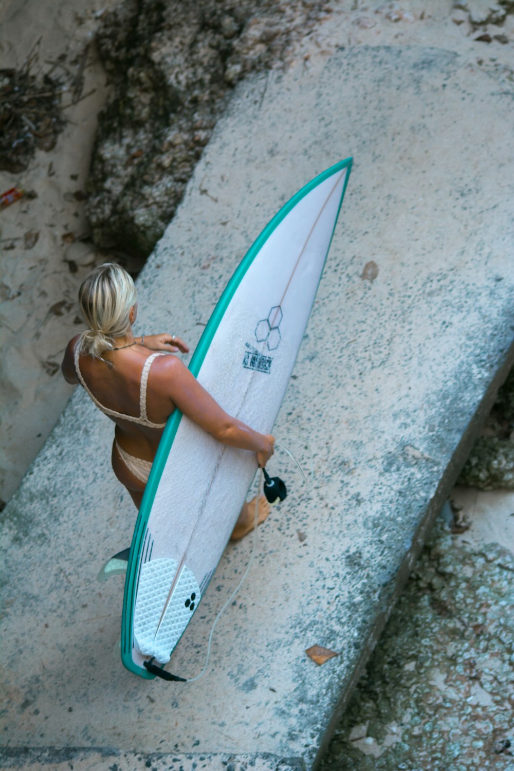 woman holding surf board