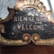 Close-up of a beautifully crafted sign with intricate details and colors.