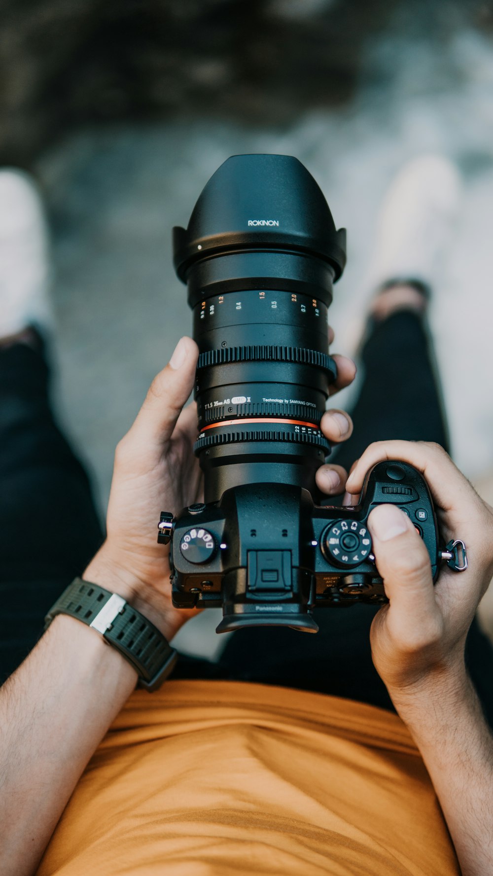 person holding black DSLR camera