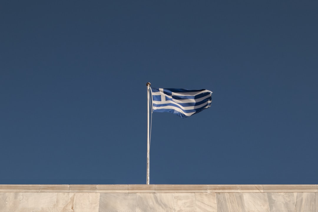 blue and gray flag on rooftop,