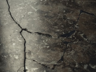 Close-up of sealed cracks on concrete floor