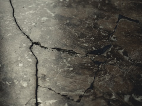 A close-up of a concrete slab being cut.