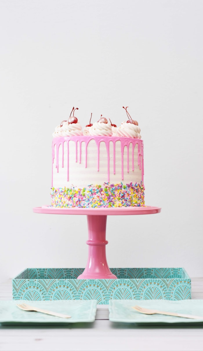 Beautiful birthday cake with colorful decorations and candles - Subbu Cake Shop bakery creation