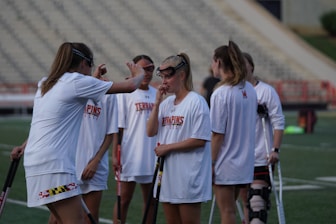 Coach Lauren Deckert encouraging a group of focused players