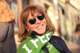 smiling woman wearing black sunglasses