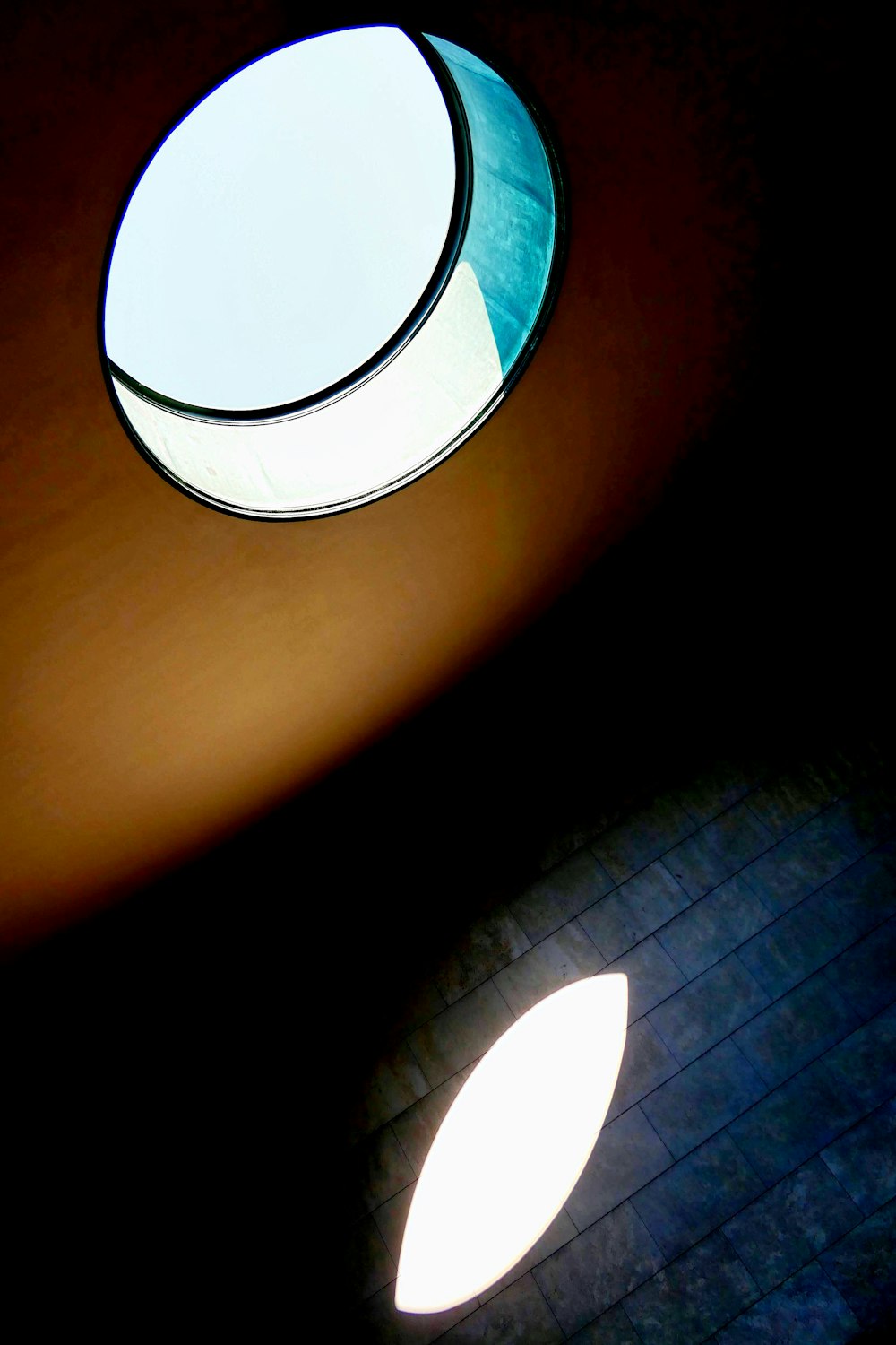 a round window in the ceiling of a building