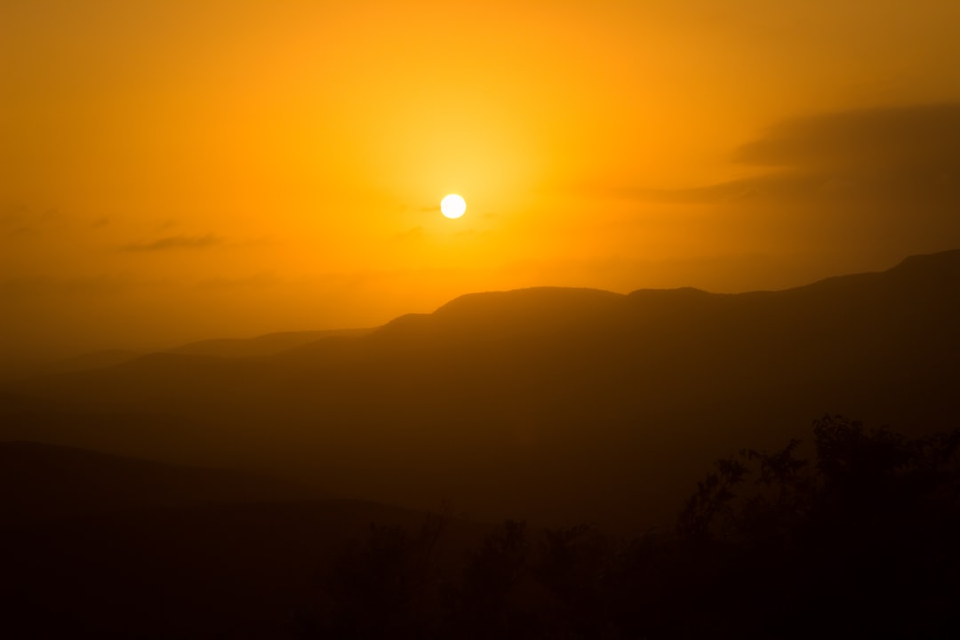 silhouette of mountain during sunset