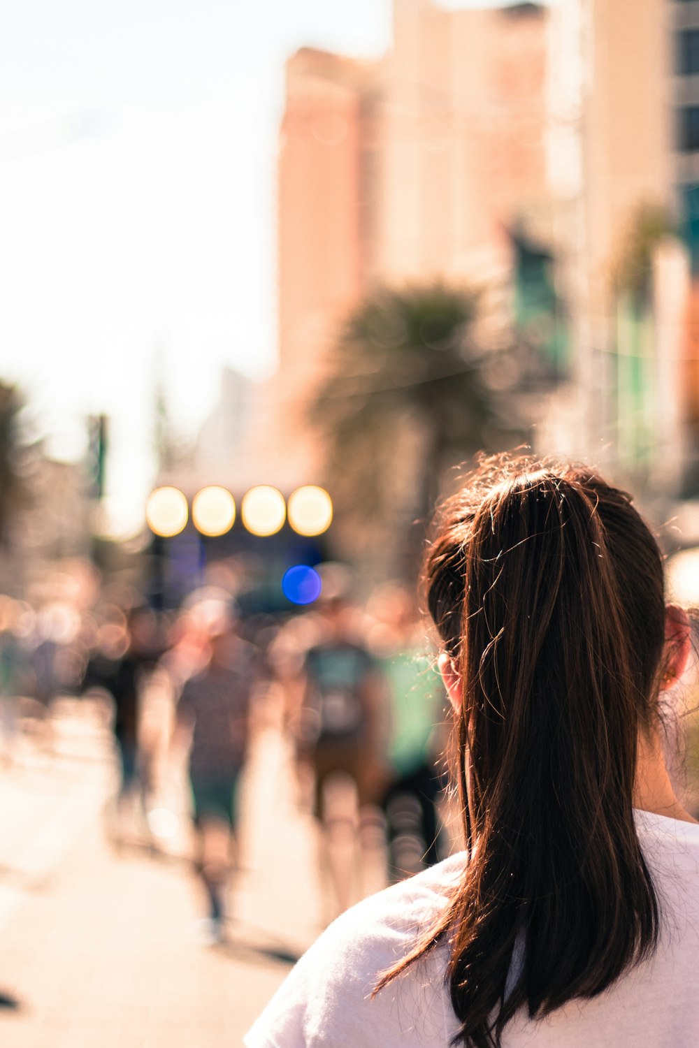 selective photo of woman standing outside during daytime