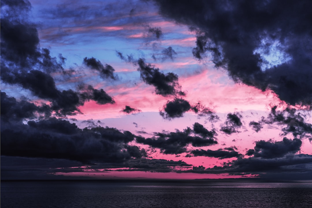 ocean under cloudy sky during daytime