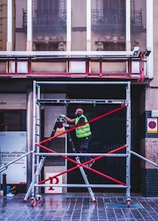 Technician inspecting safety features on a scaffold platform