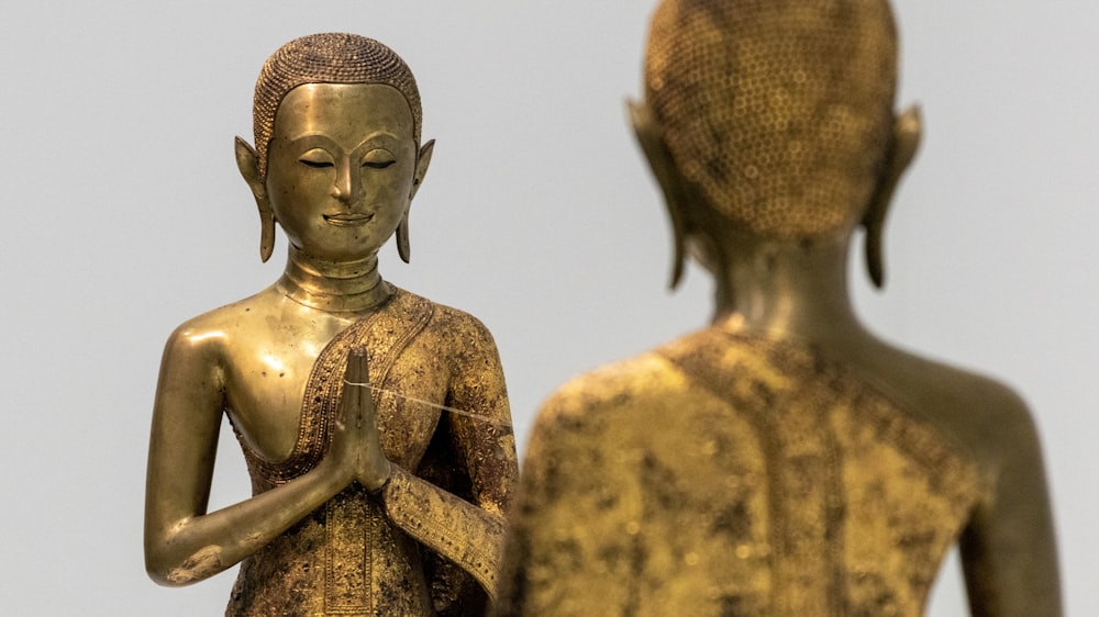 gold Buddha praying statue
