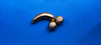 Colorful animated banana mascot presenting fresh fruits and vegetables with cheerful background.