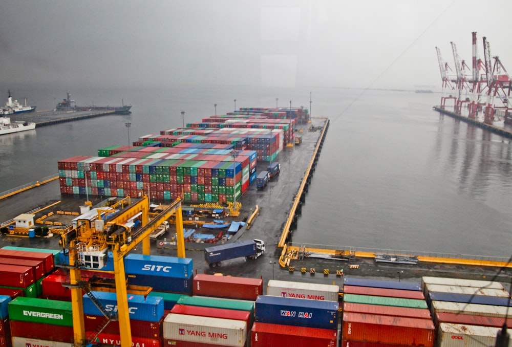 assorted shipping container lot near body of water