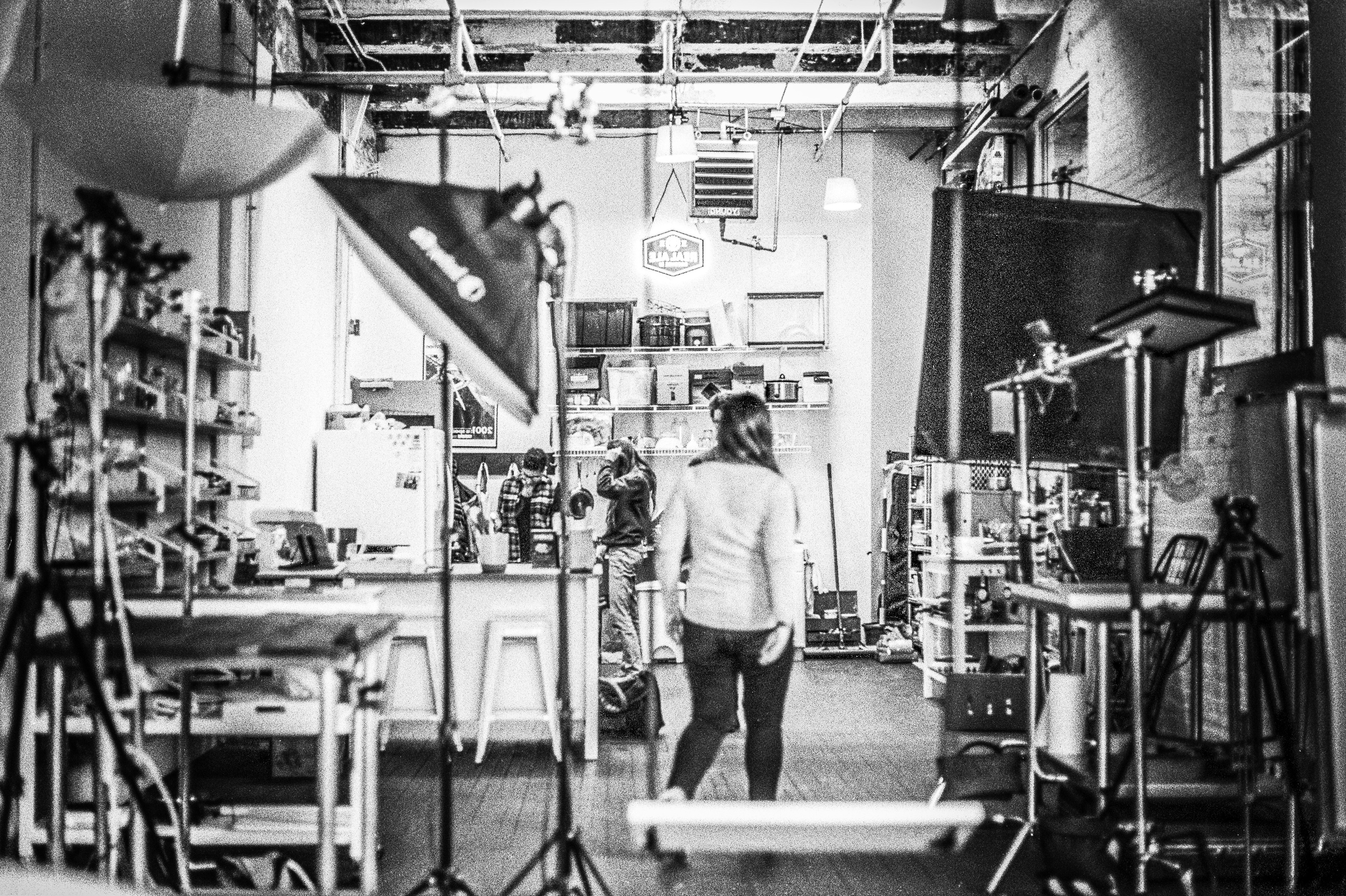 woman walks into photo studio room, 