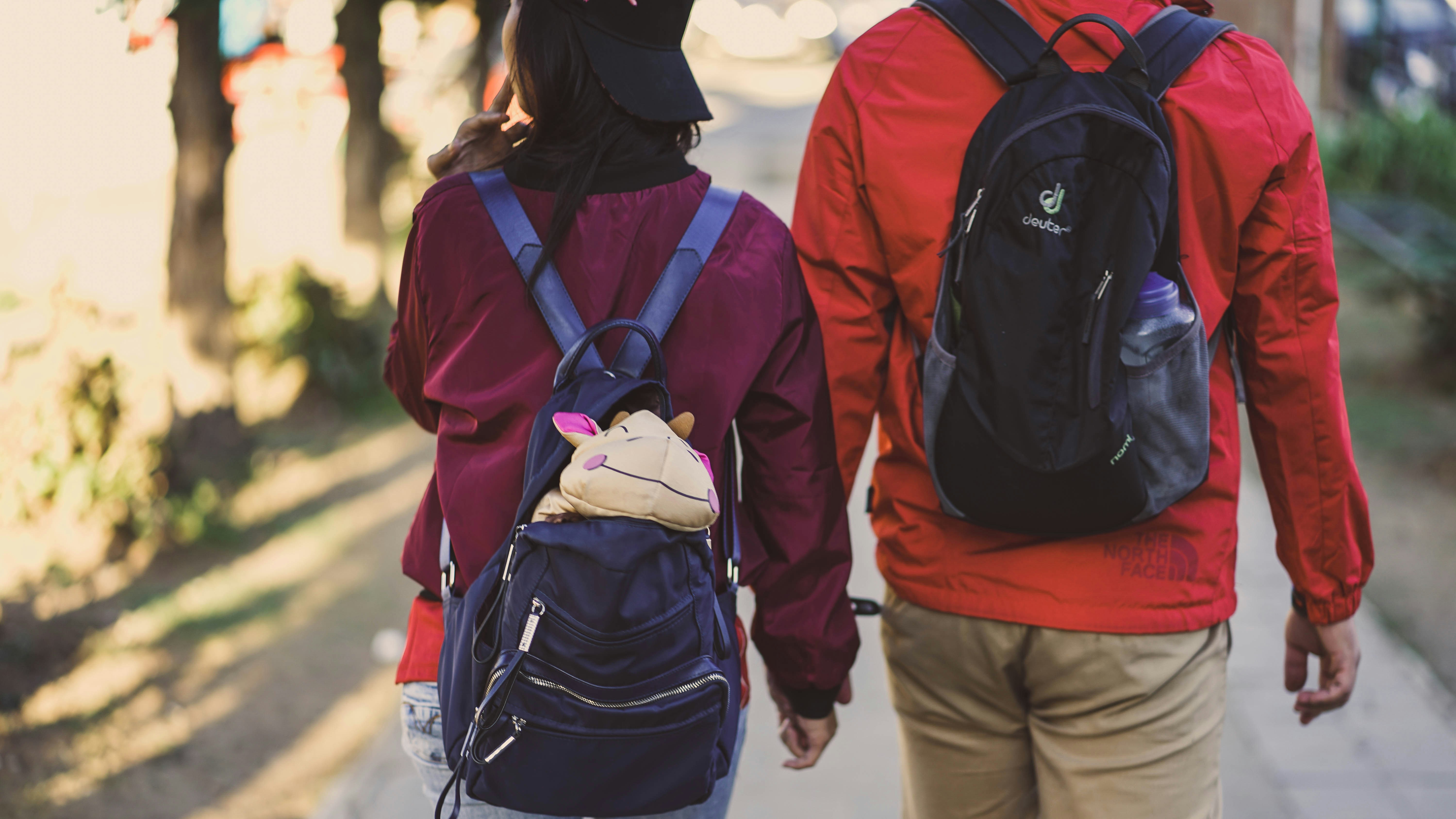 Man and woman with backpacks