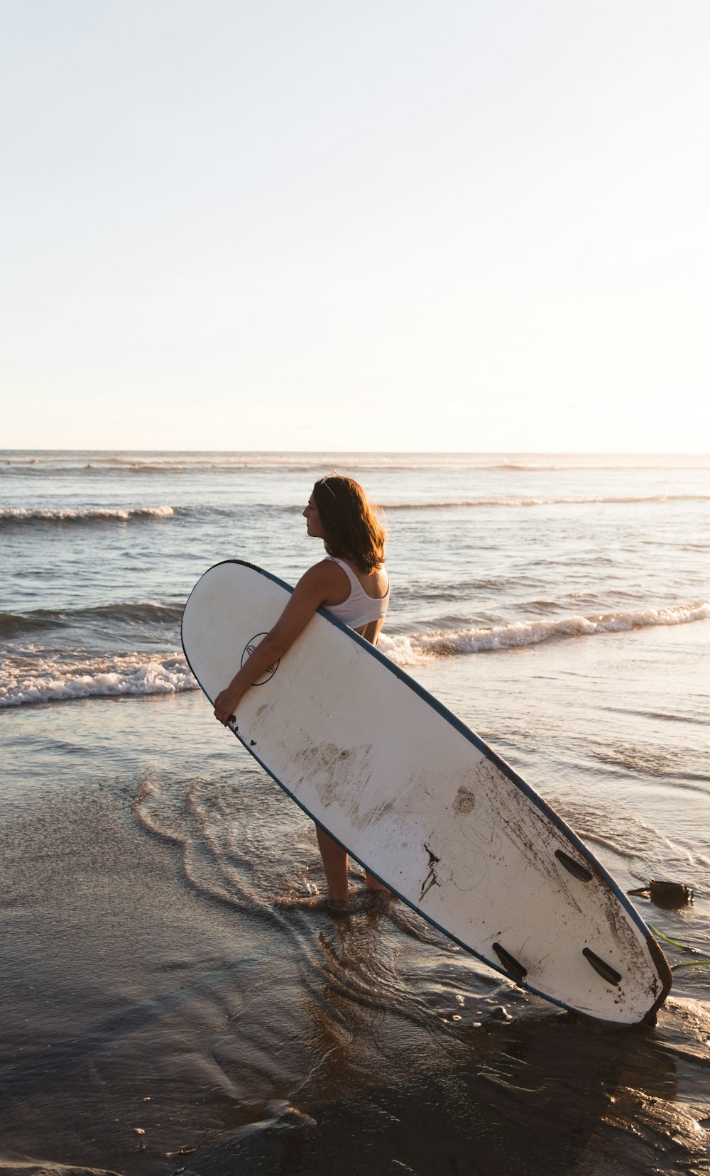 woman holding surfboard