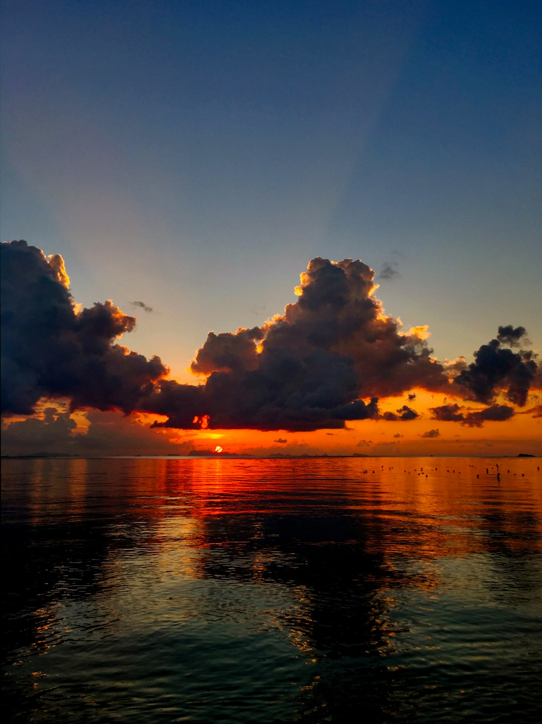 calm water under clouds