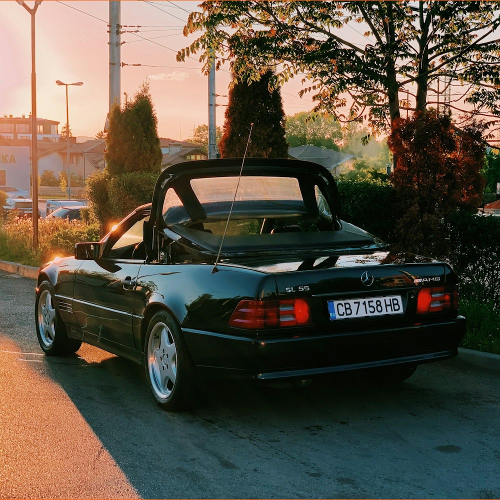 black coupe parked near road