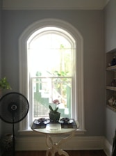 A serene image of an air purifier in a bright, clean room.