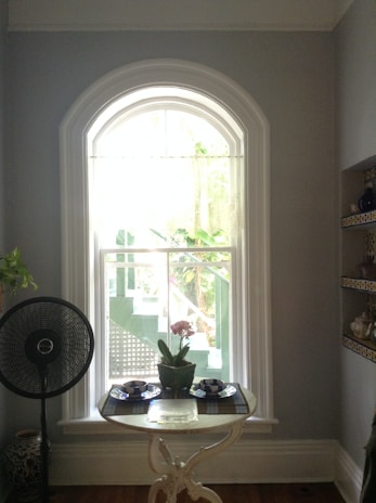 A serene image of an air purifier in a bright, clean room.