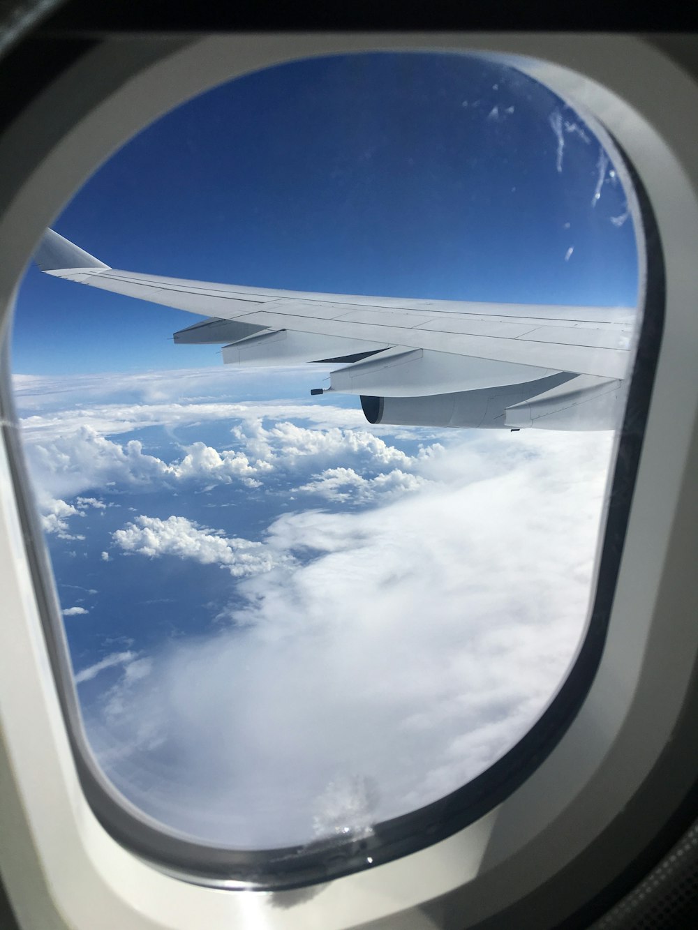 a view of the wing of an airplane through a window