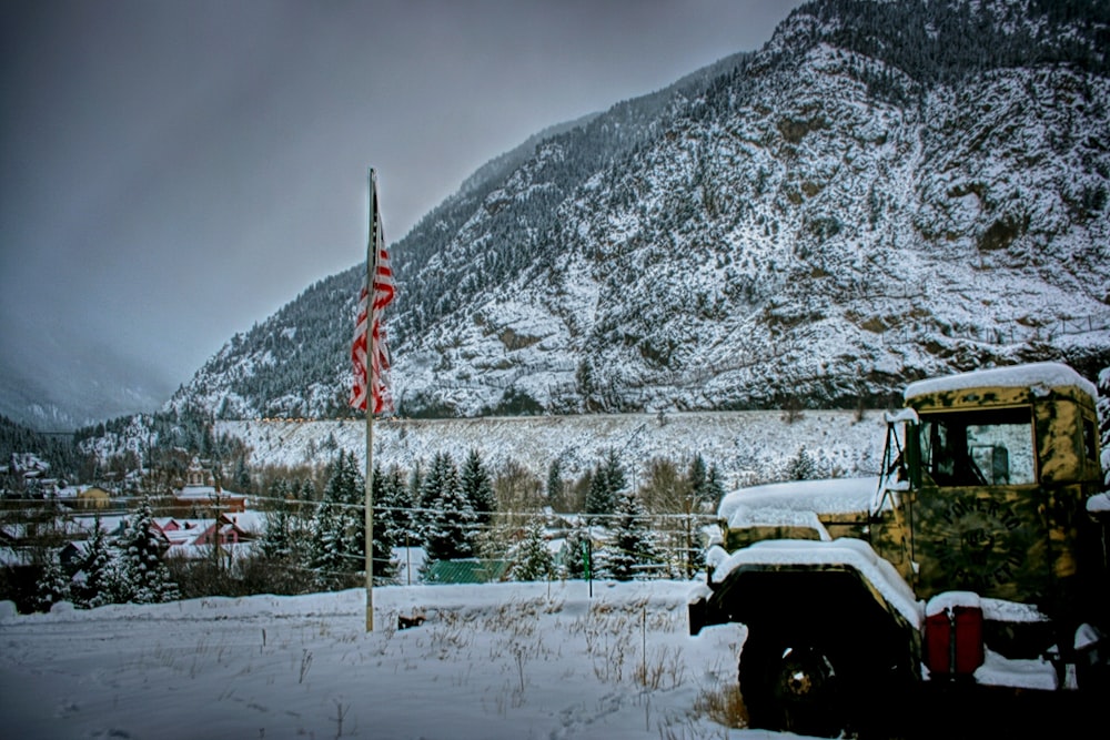 yellow truck near hills