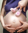 pregnant wearing blue dress