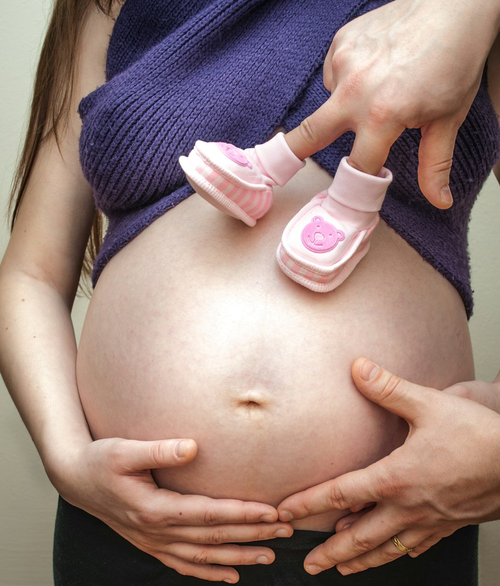 pregnant wearing blue dress