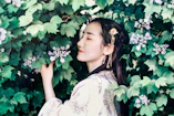 woman standing near trees