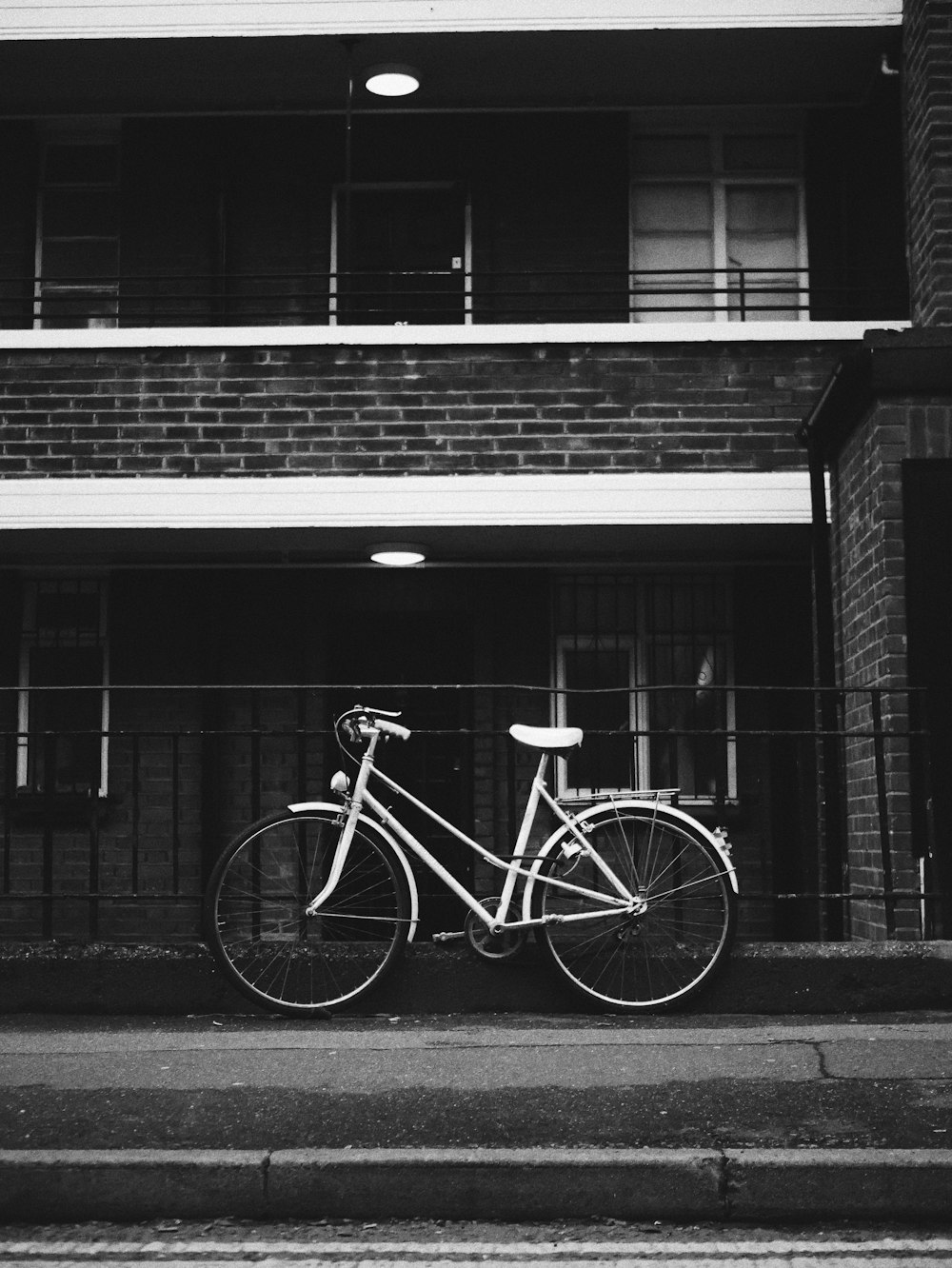 bicycle parked near metal railings