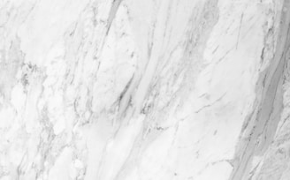 a close up of a white marble wall