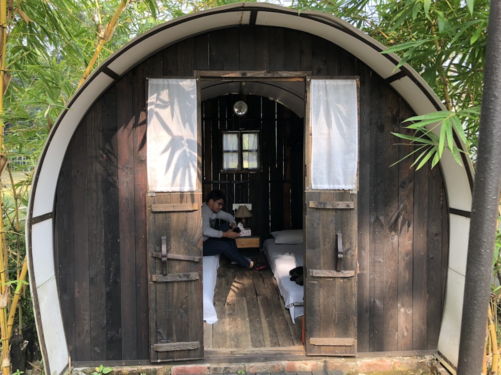 man sitting inside dome bungalow