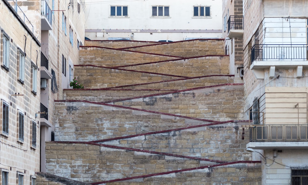 brown concrete pathway near buildings