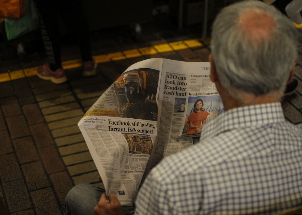 man reading newspaper