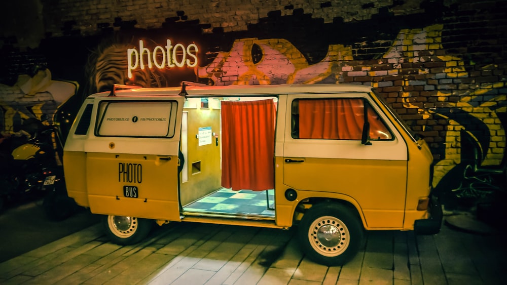 yellow van photo booth near building
