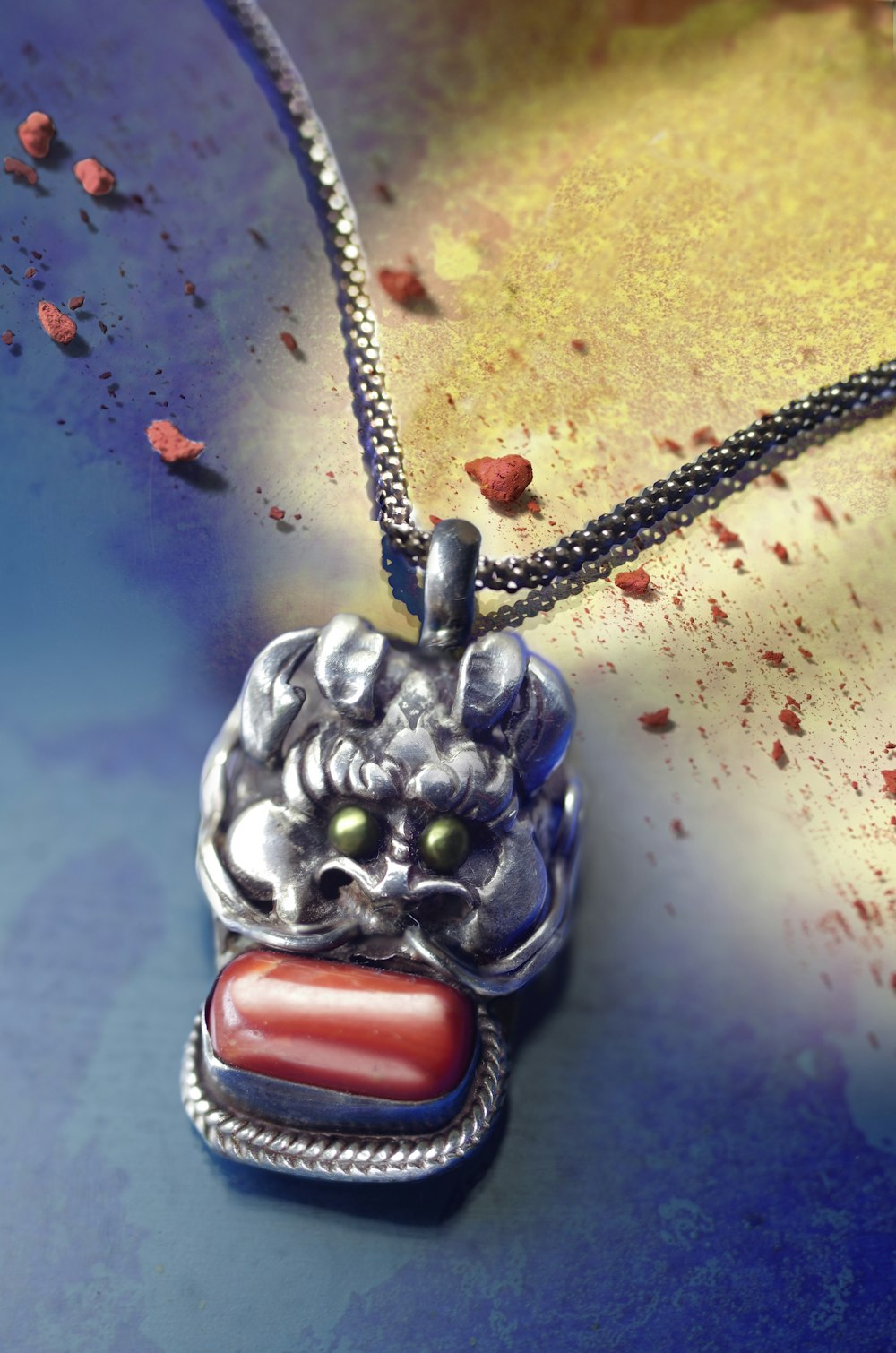 silver dragon with red cabochon pendant