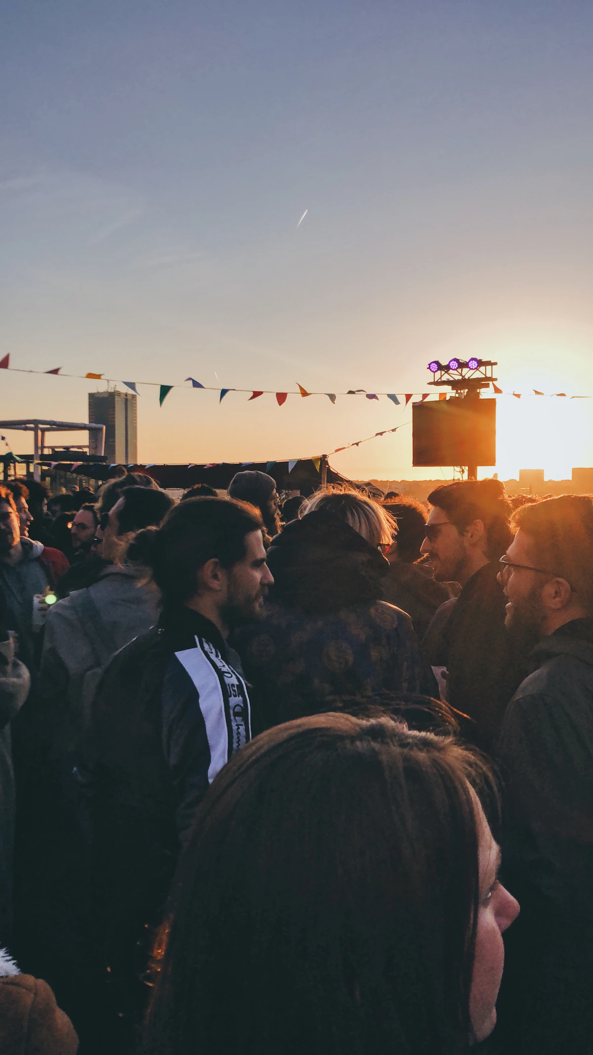 Candidate B — outdoor festival golden hour