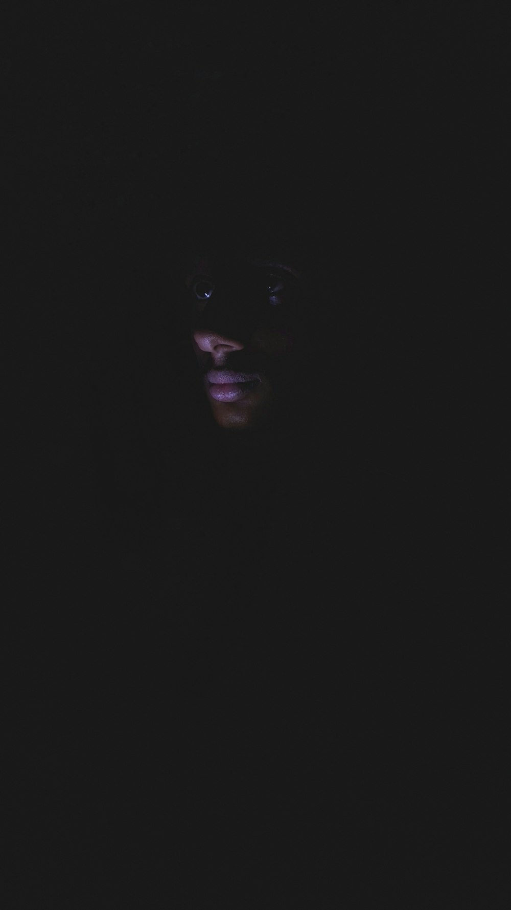 man in dark room