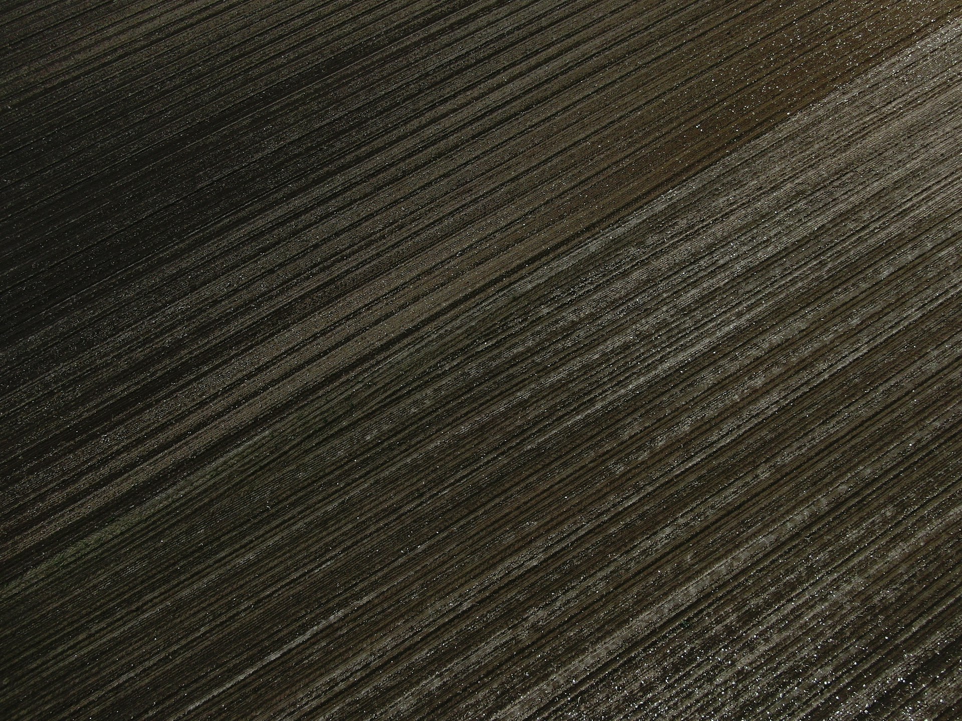 an aerial view of a plowed field