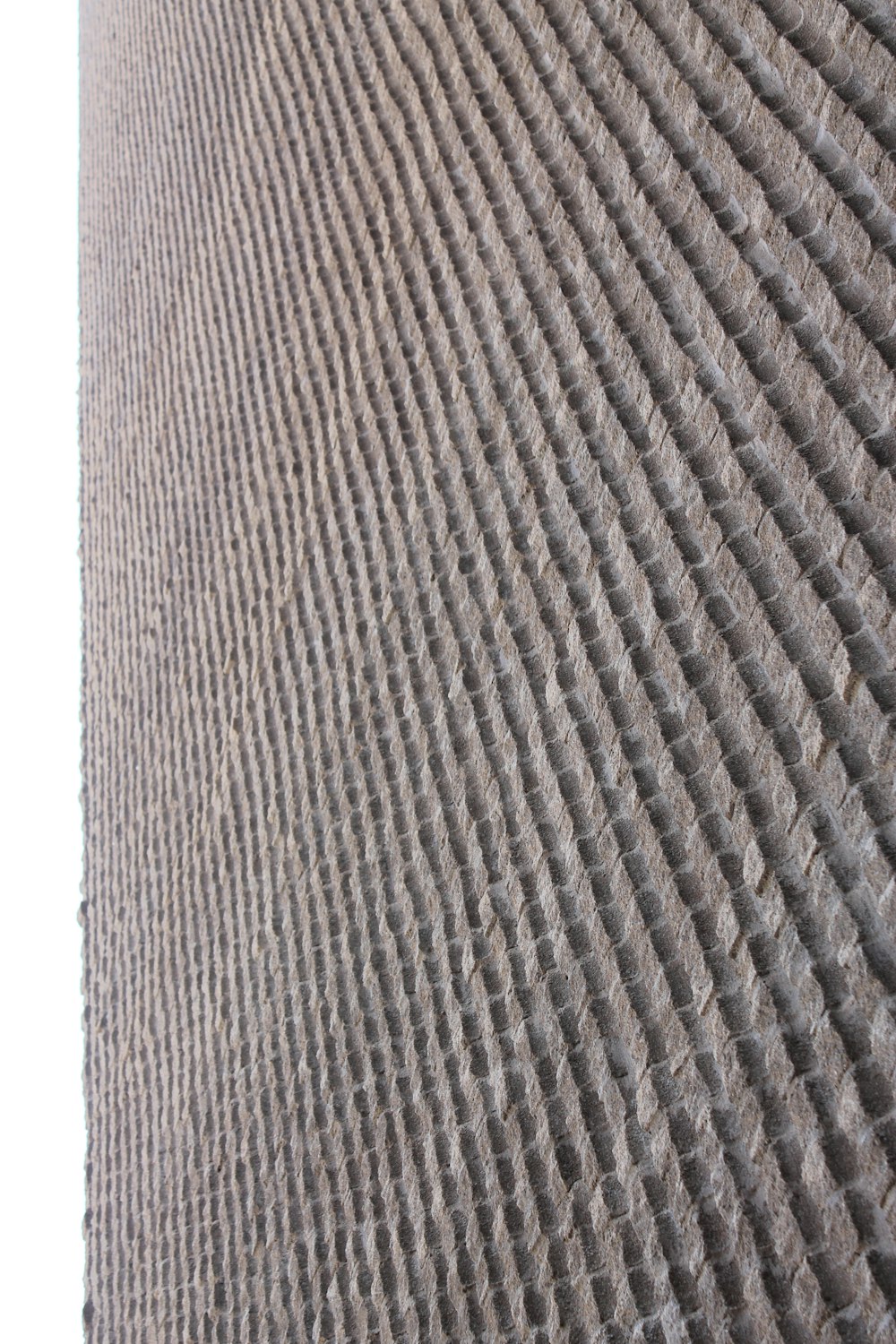 a close up of a sand dune with a sky background