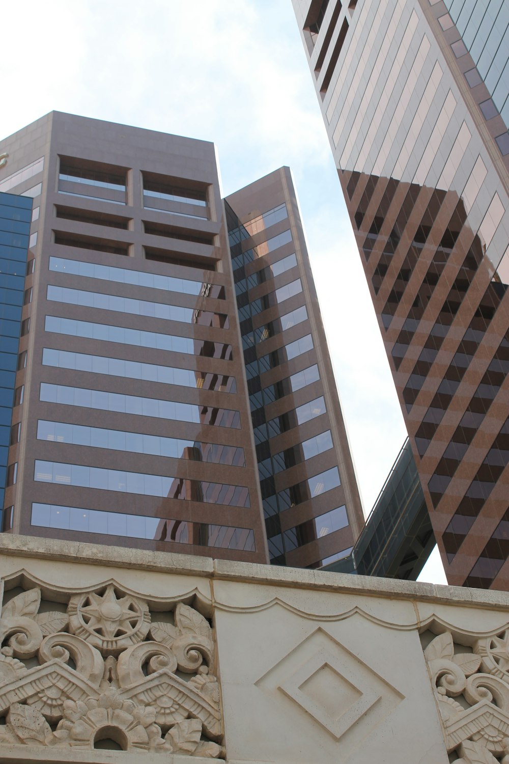 white glass walled high-rise buildings