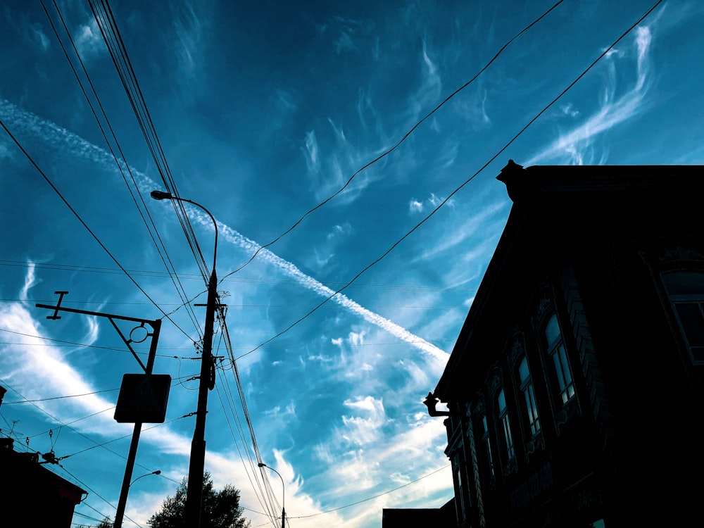 a blue sky with some contrails in the sky