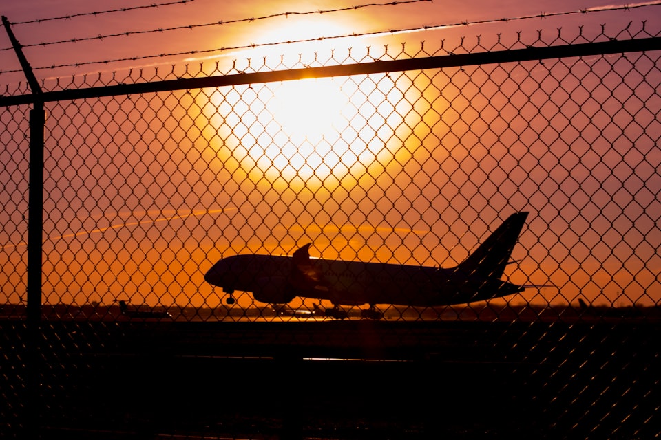Air Canada plane taking off into the sunset