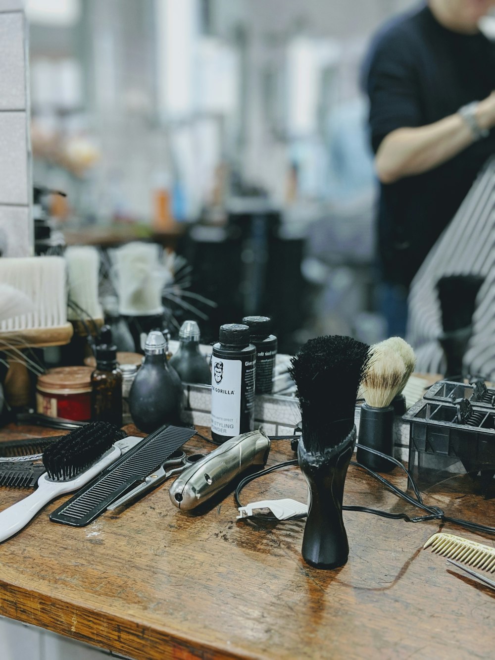 barber items on desk near mirror