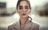 woman wearing grey peaked suit jacket