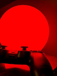 A caution sign with a game controller illustration signaling responsible gaming.