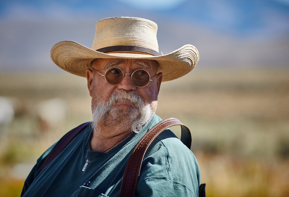 man wearing green shirt and brown hat